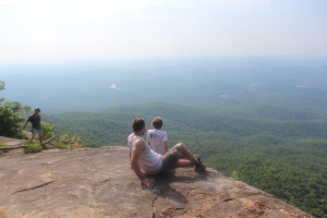Grant and Ashten perched atop Pinnacle as Alan (left) takes in the views